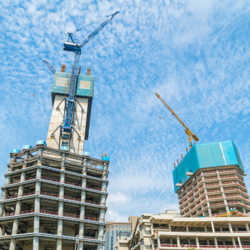 Construction site in Gurgaon with multiple high-rise buildings under construction.