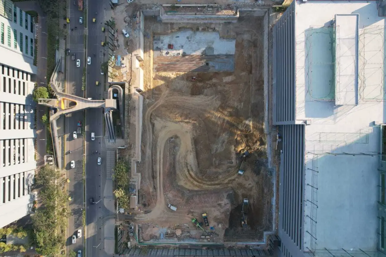 Aerial view of a construction site in Jaipur, showing excavation work for a diaphragm wall project.